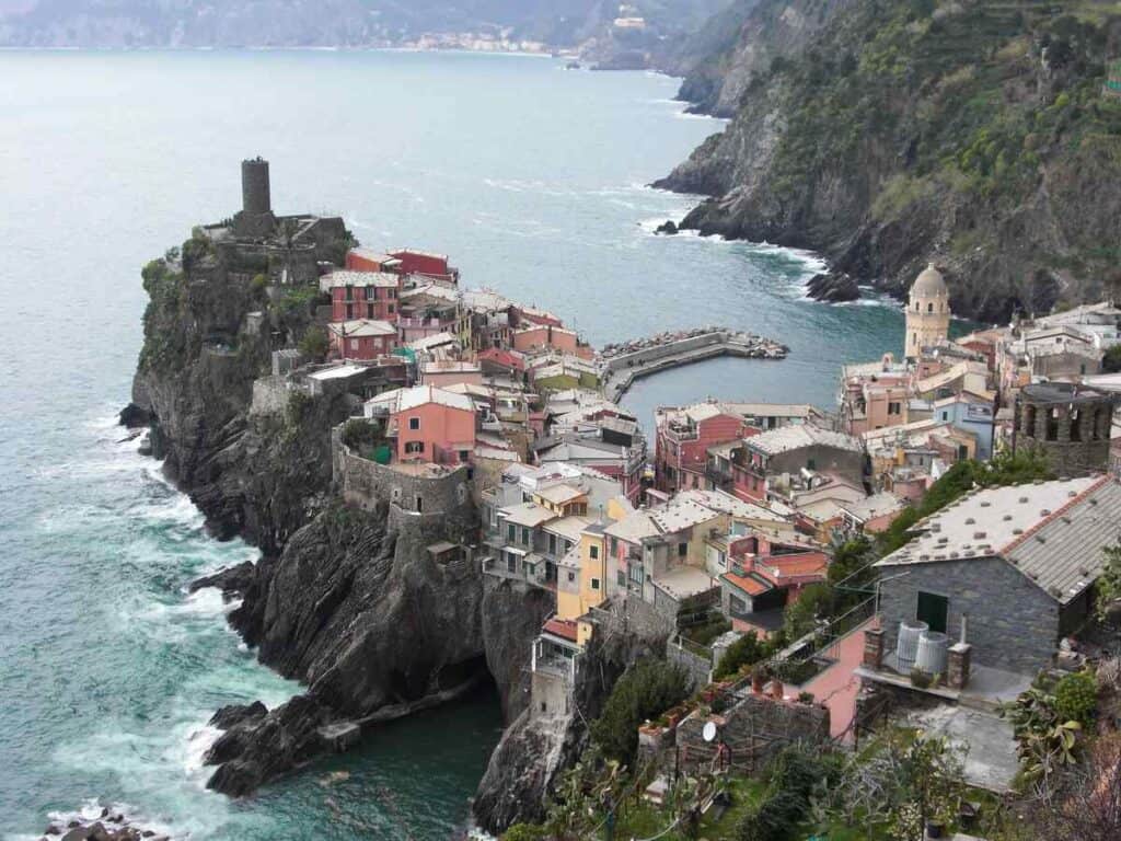 The coastal village Vernazza at the Cinque Terre is surrounded by the Mediterranean Sea. The best view is from the hiking trail leading down to the center.