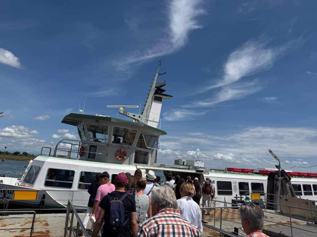 people entering the Vaporetto water bus to venice